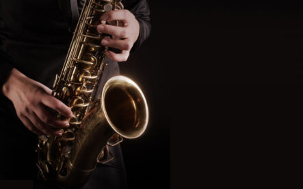 wind Saxophone Player Saxophonist playing jazz music. Sax alto Jazz Musician hands closeup